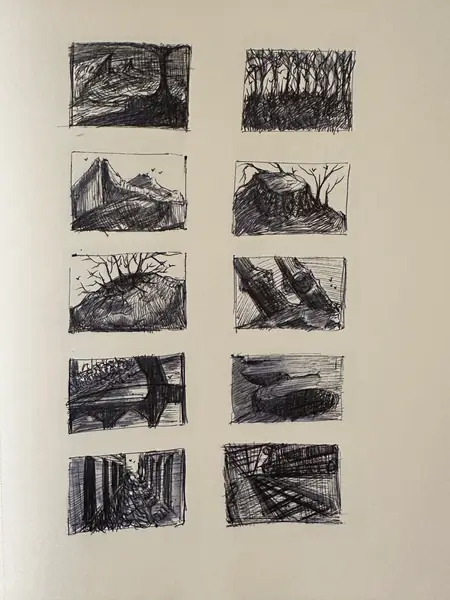 A sketchbook page gathers small studies of imagined characters, forms, and environments.