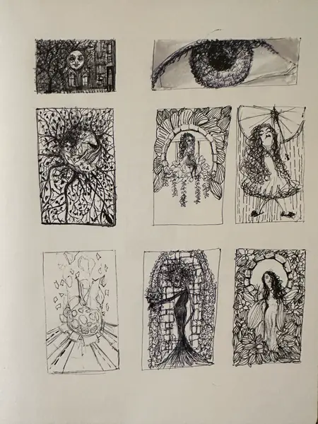 A sketchbook page gathers small studies of imagined characters, forms, and environments.