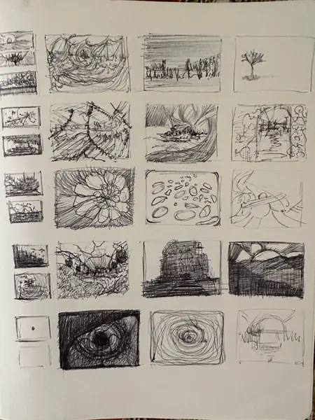 A sketchbook page gathers small studies of imagined characters, forms, and environments.