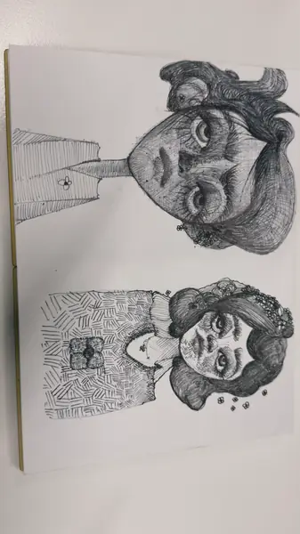 A sketchbook page gathers small studies of imagined characters, forms, and environments.