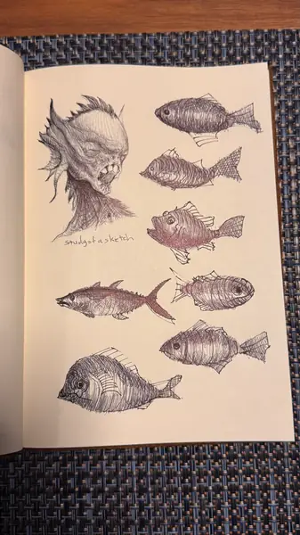 A sketchbook page gathers small studies of imagined characters, forms, and environments.